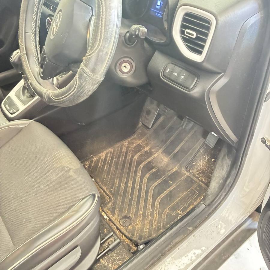 Front interior before detail, dirt and debris through the footwell